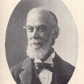 Charles Larned: Black and white portrait of an older man with a beard and mustache, wearing glasses, a bow tie, and a suit jacket, facing slightly to the right.