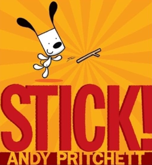 Cartoon dog jumps to catch a stick above large red text reading "STICK!" and "ANDY PRITCHETT" on a yellow background with sunburst pattern.