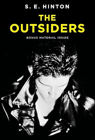 black and white book cover of "the outsiders" by s. e. hinton, featuring a young man in a leather jacket looking down, with yellow and white text above.